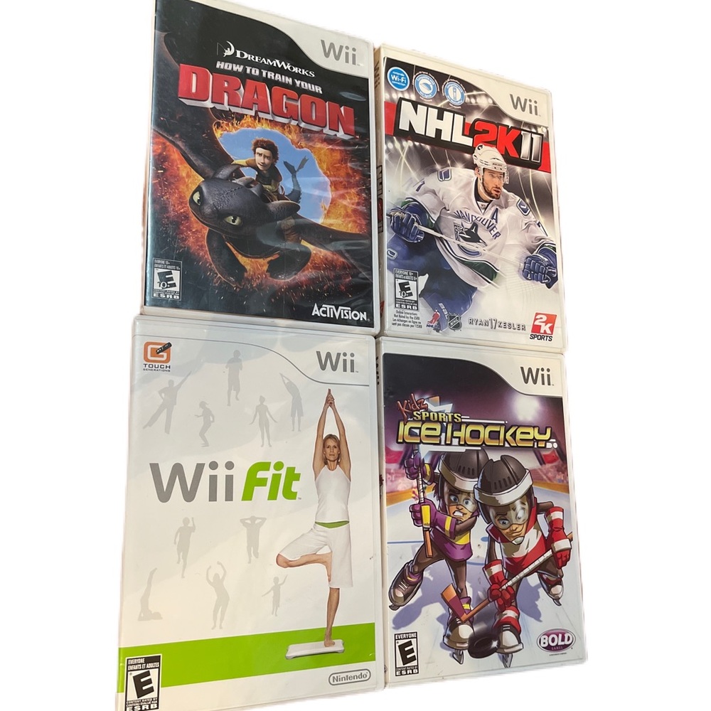 Wii game bundle - wii fit, ice hockey, NHL2K11, how to train your dragon